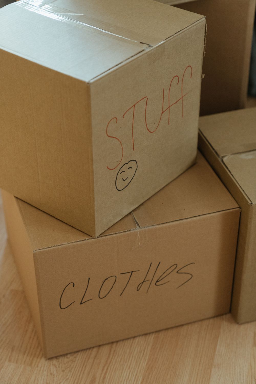 A family packing moving boxes, ready for their next chapter
